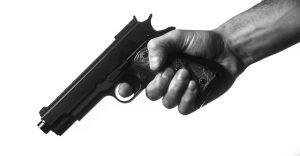 hand holding a gun