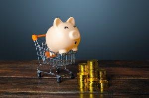 Piggy bank surprised by stacks of coins.