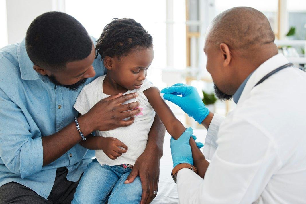 Covid, dengue and medical vaccine of a child with father and kid doctor and pediatrician. Healthcar
