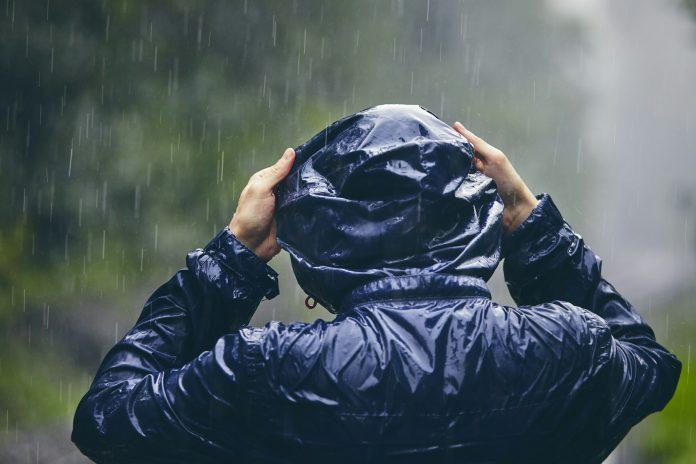 Traveler in heavy rain