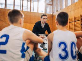 Team listens intently to coach's directions