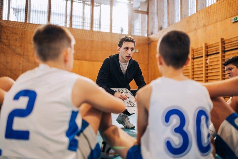 Team listens intently to coach's directions